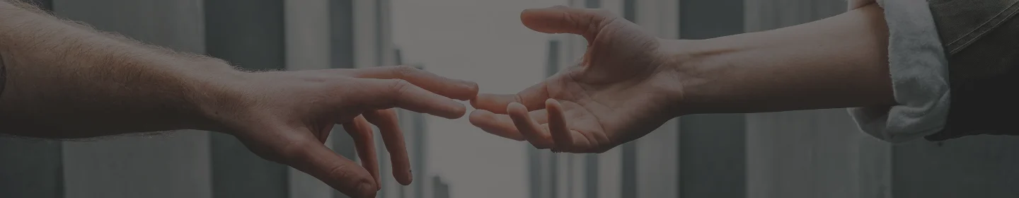 Background image of a hand holding puzzle pieces